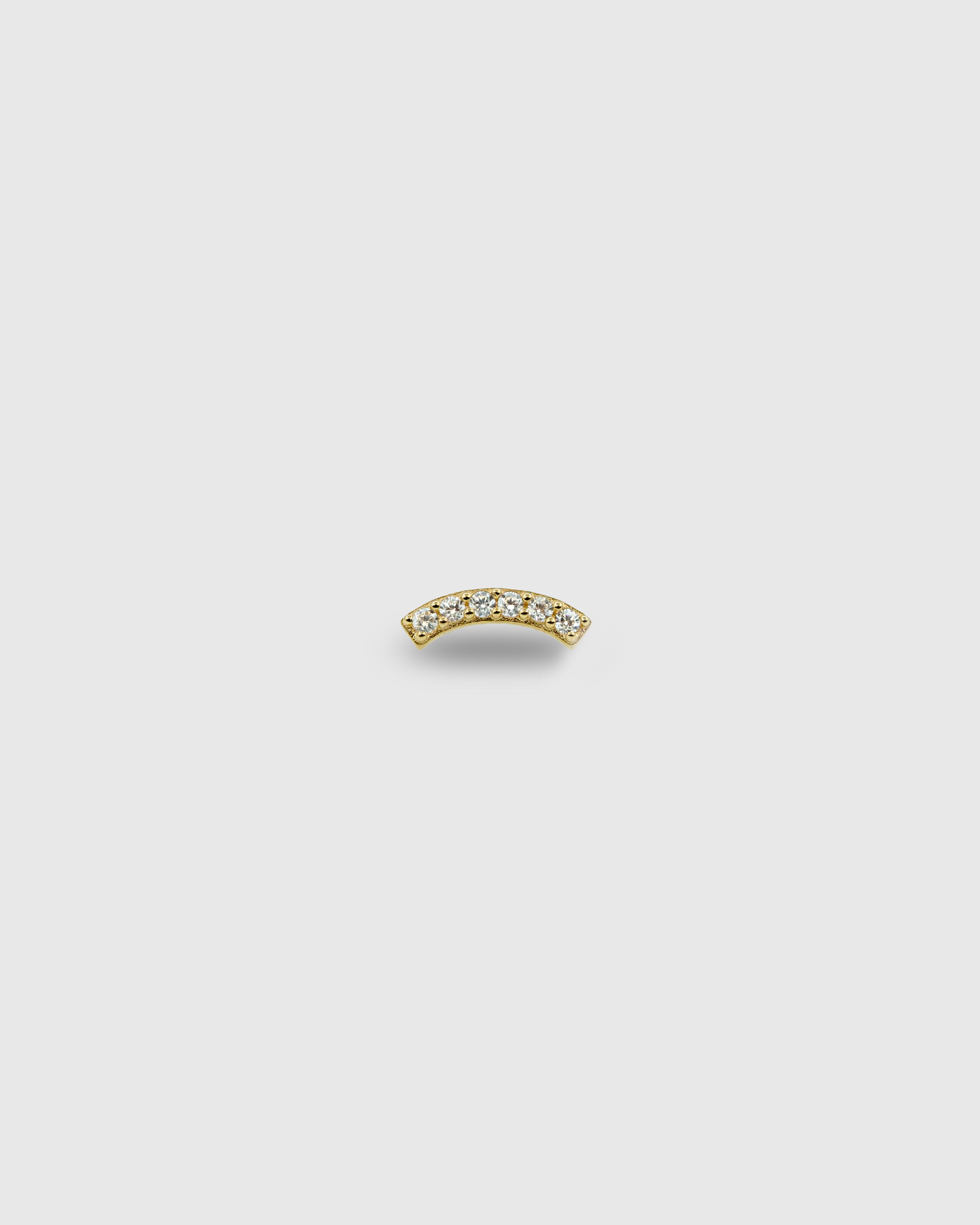 Piercing curvo de oro sólido de 14k con circonitas