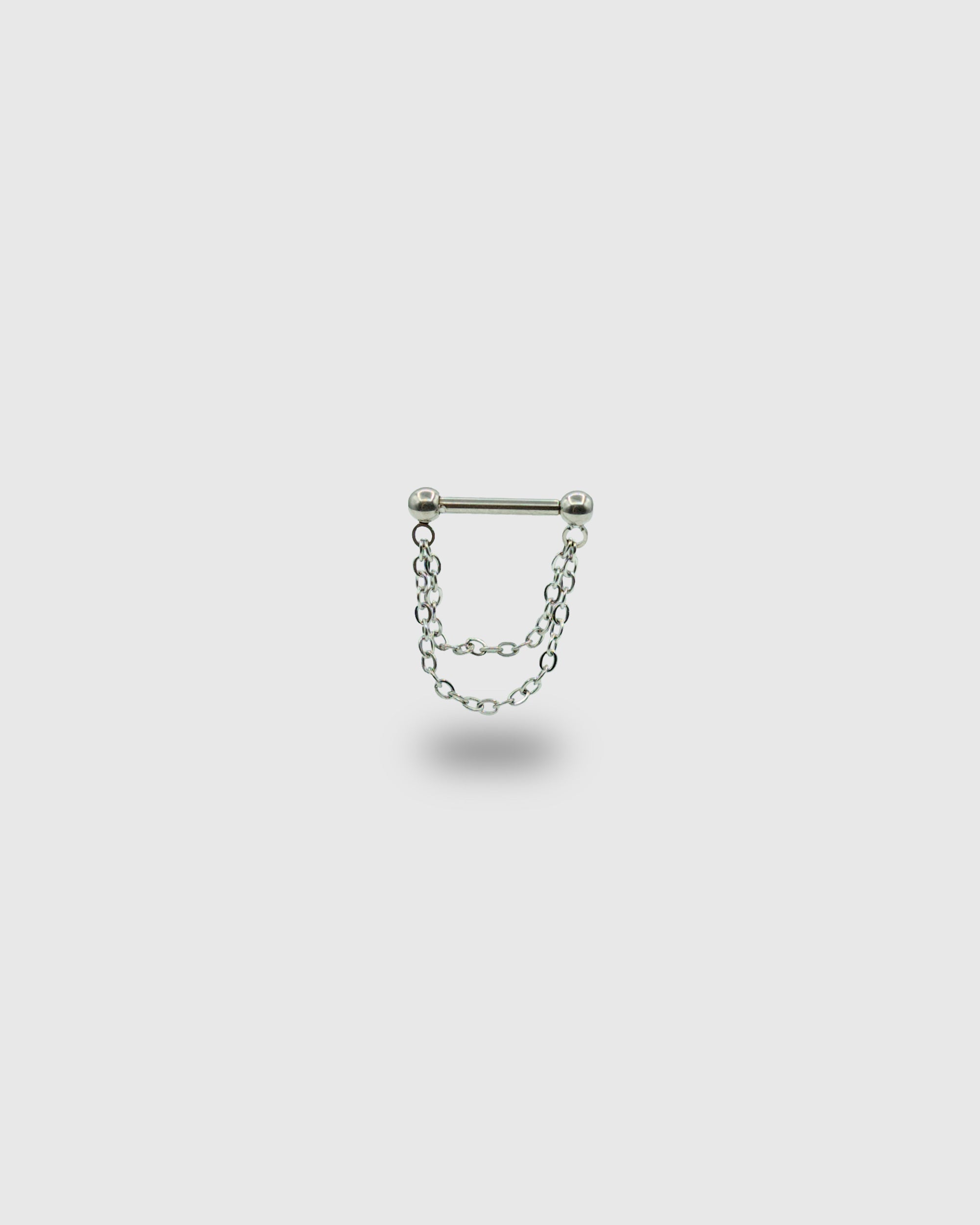 Piercing barra de titanio con cadenas