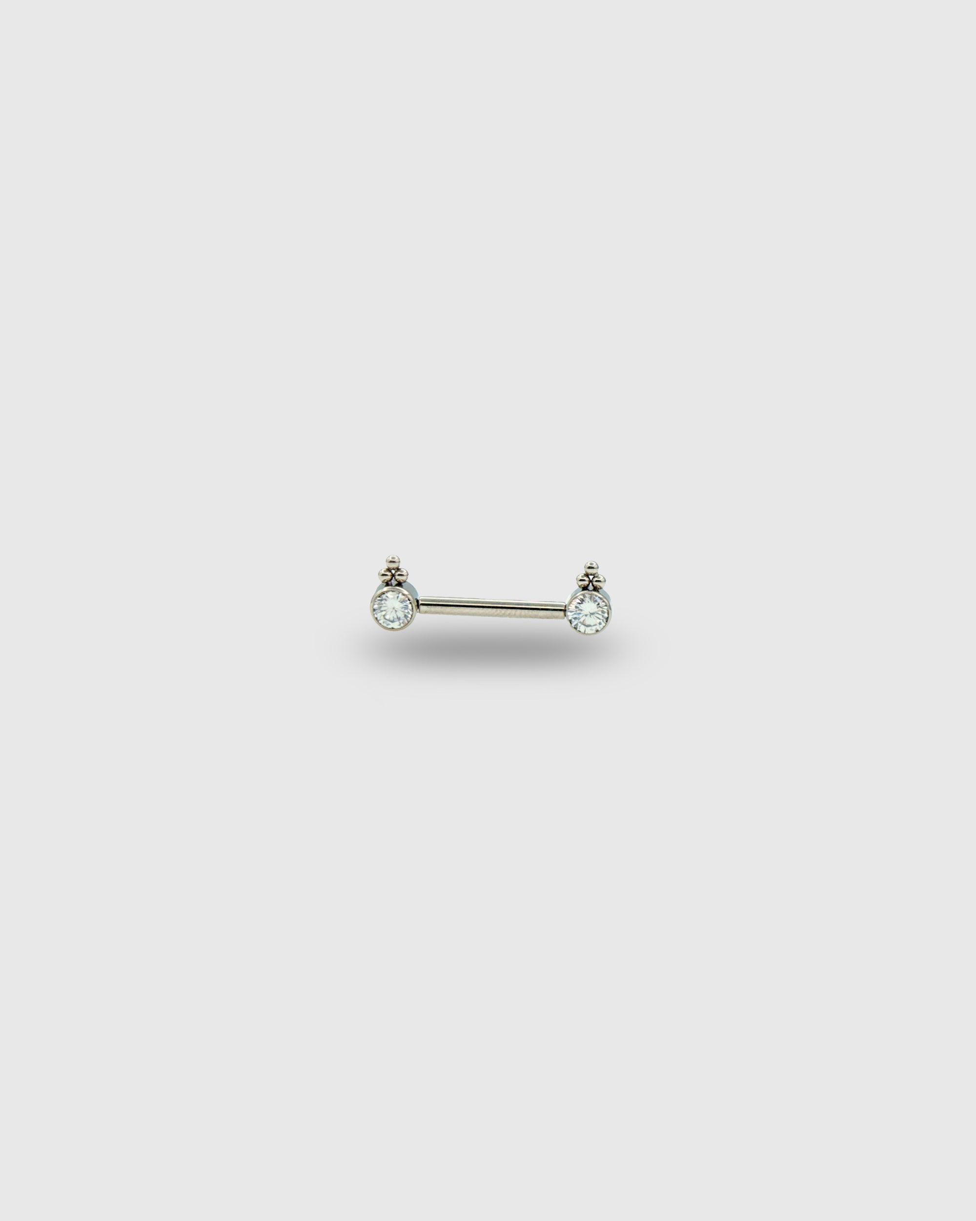 Piercing para pezón con circonitas y trío de cuentas