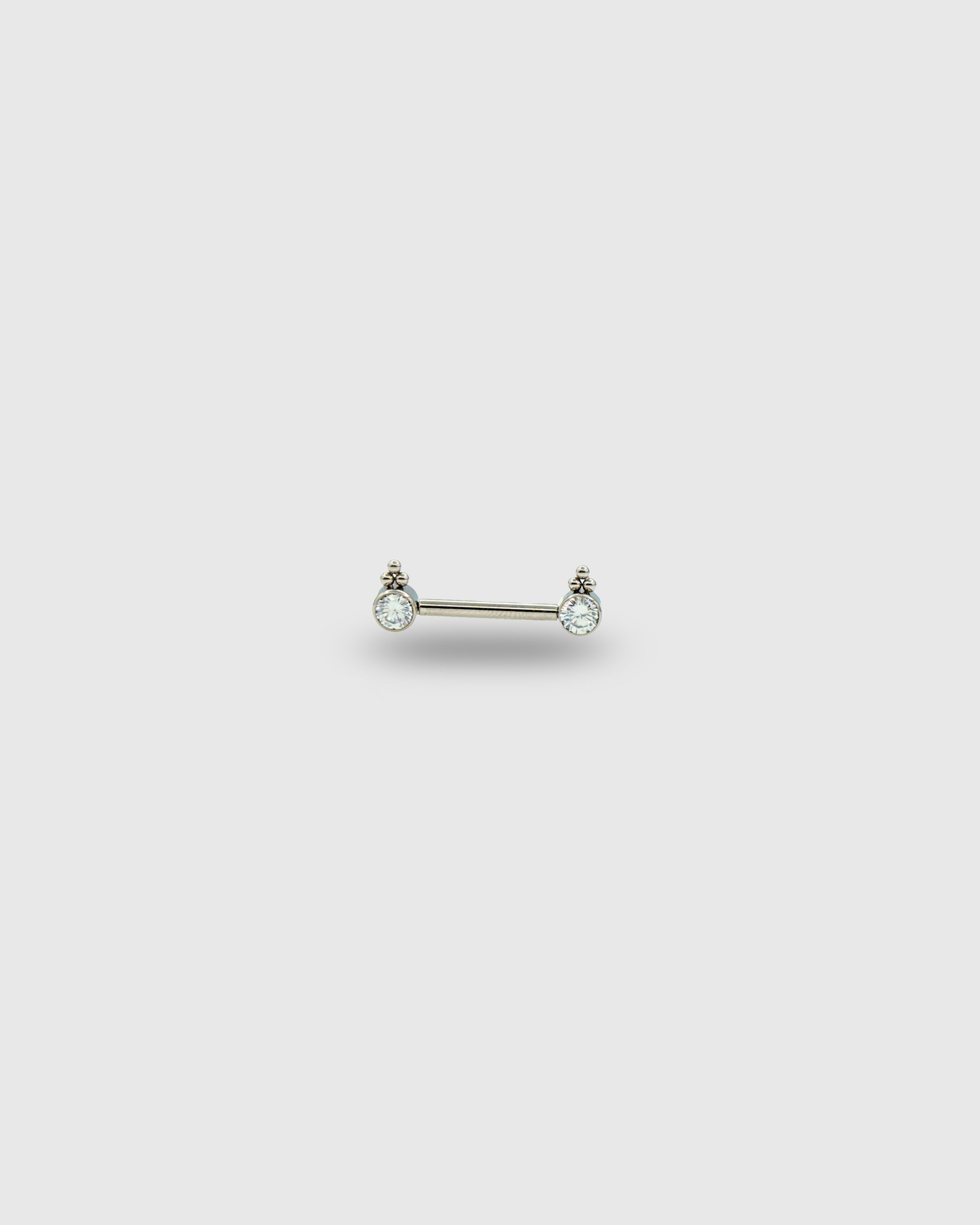 Piercing para pezón con circonitas y trío de cuentas
