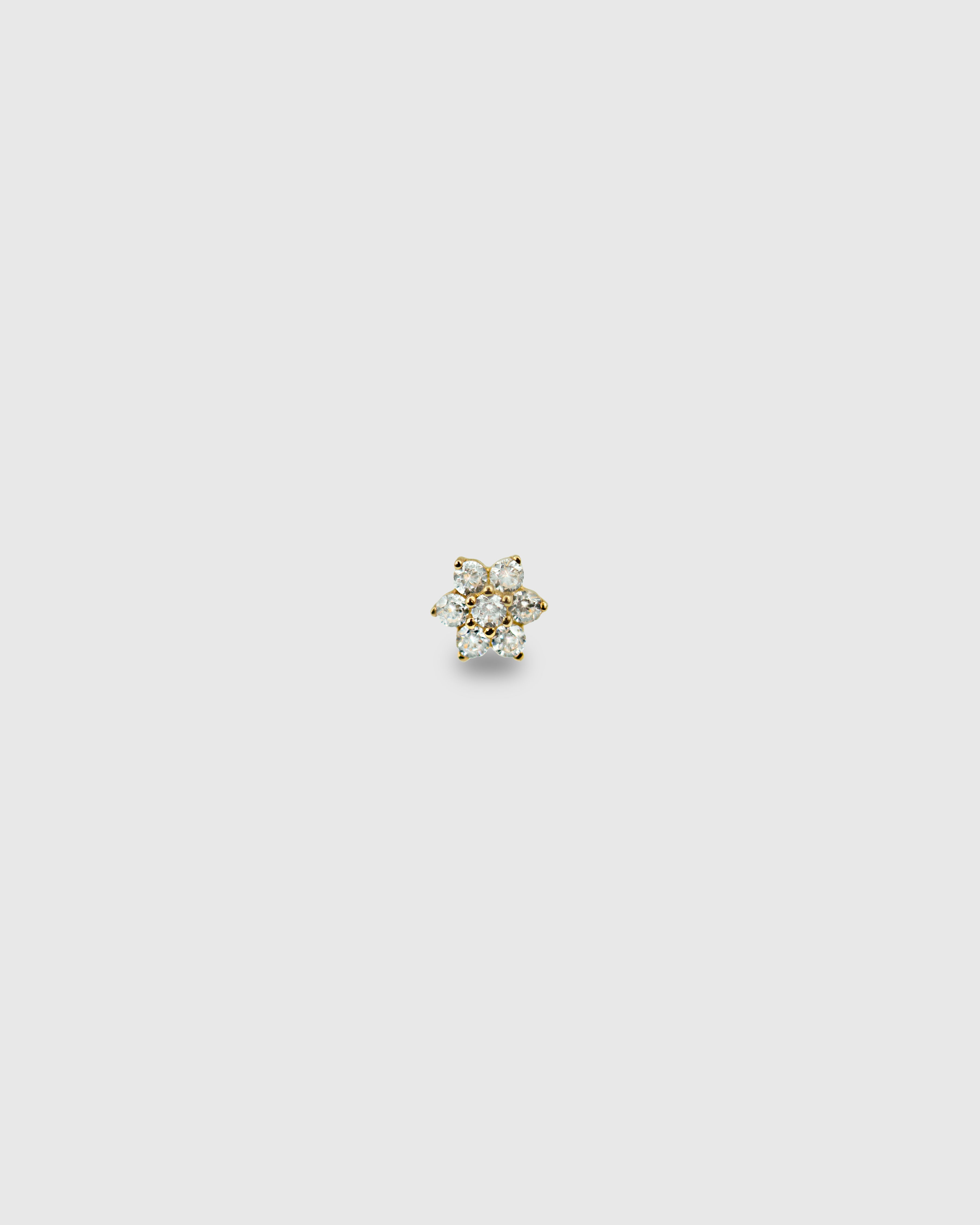 Pendiente flor de oro sólido de 14k con pétalos de circonitas