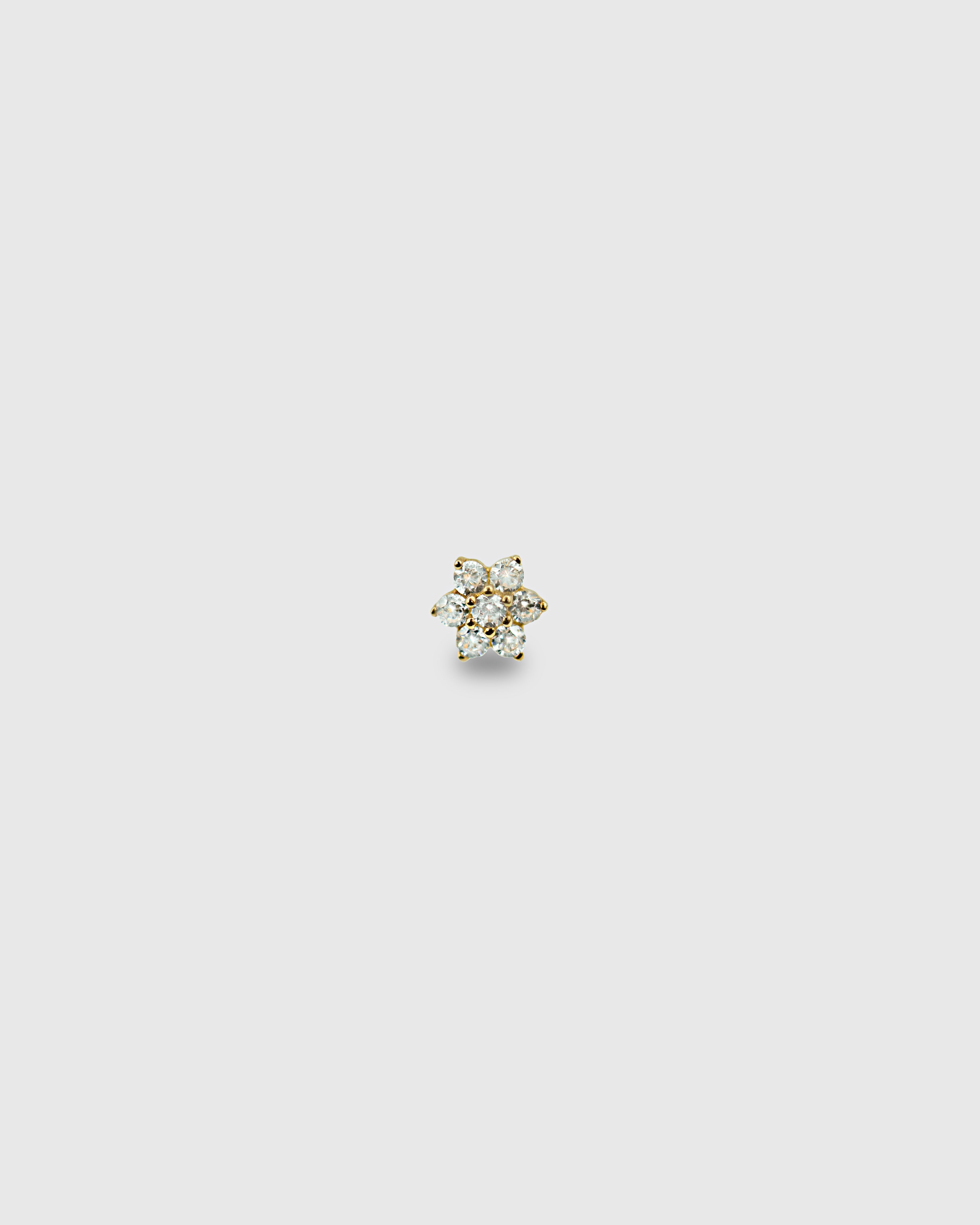 Piercing flor de oro sólido de 14k con pétalos de circonitas