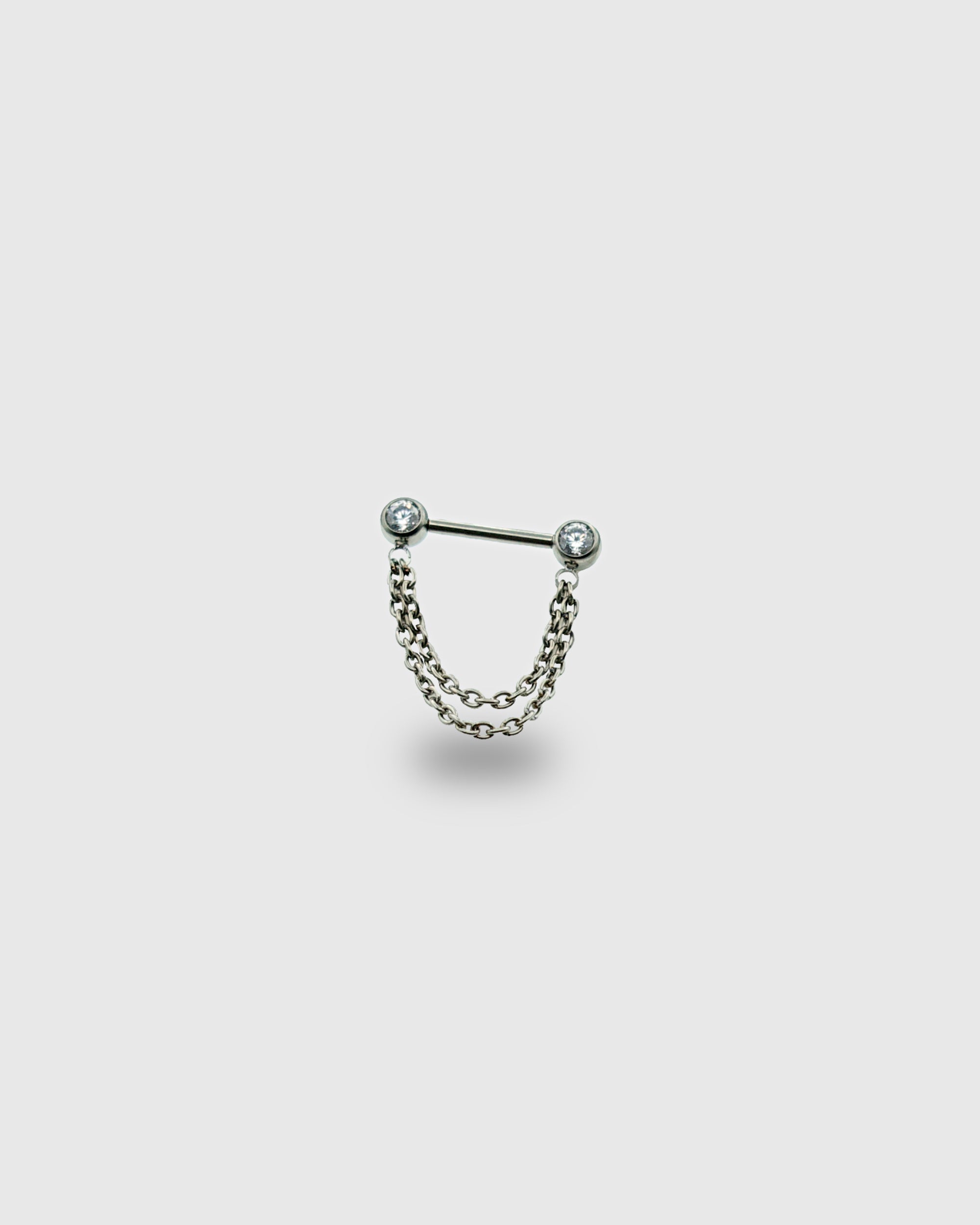 Piercing para pezón con circonitas y doble cadena