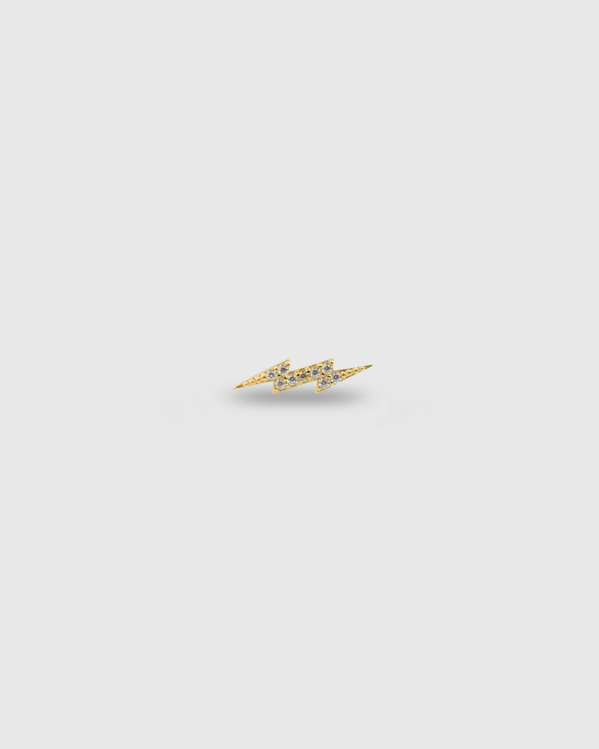 Piercing rayo de oro sólido 14k con circonitas
