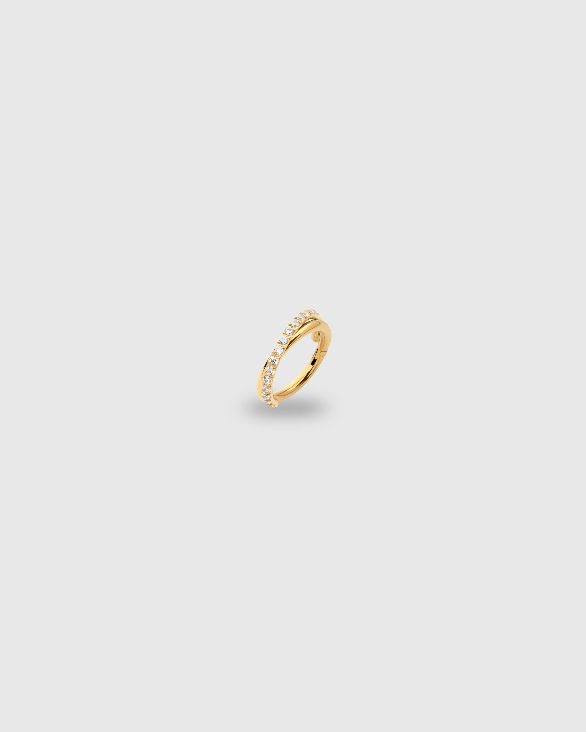 Aro cruzado con circonitas oro 24k PVD