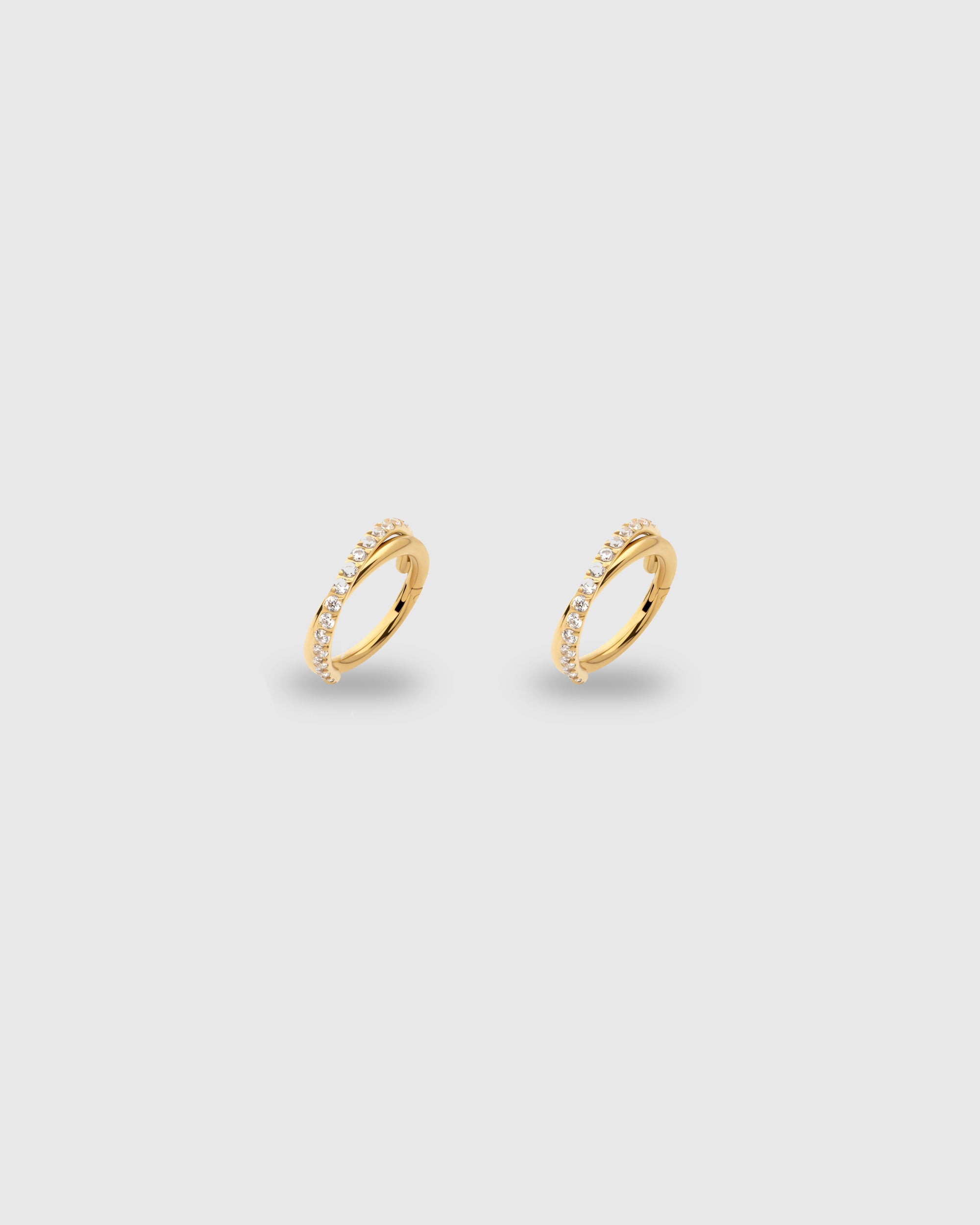 Aro cruzado con circonitas oro 24k PVD